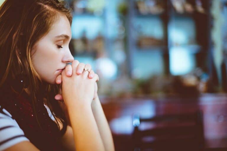 Photo of a young lady praying
